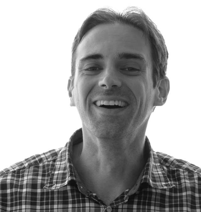 A black and white photo of Christof Lutteroth, smiling and facing the camera.